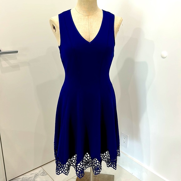 Classic style combines with modern, edge trend for a dress that is flattering. - Picture 1 of 8